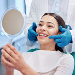 Dentist, mirror and woman check smile after teeth cleaning, braces and dental consultation