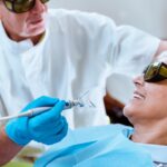 Dentist performing cosmetic procedure focused on natural tooth appearance