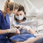 female dentists treating patient girl teeth How to Prepare for a Sedation Dentistry Appointment